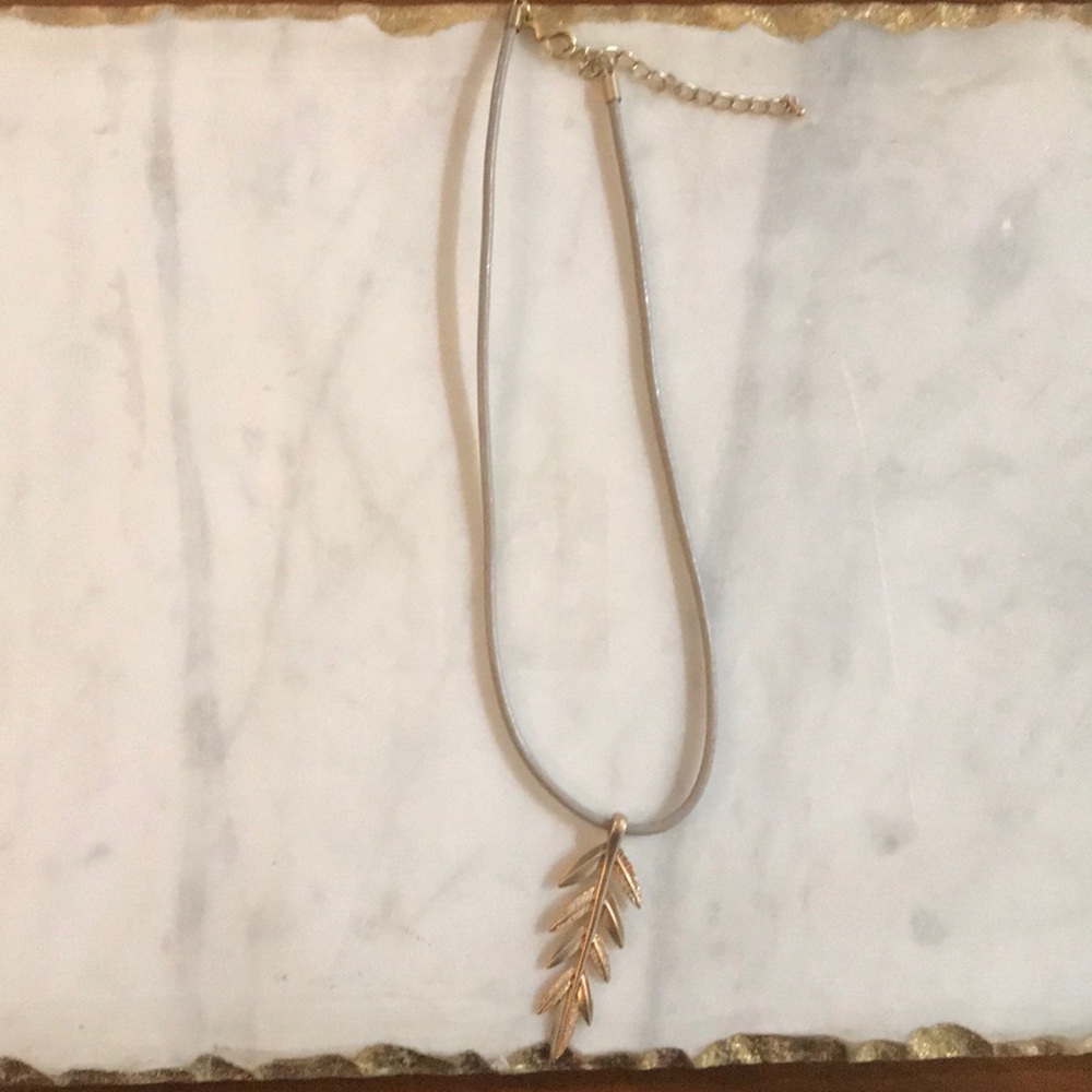 Gray leather necklace with gold drop leaf pendant